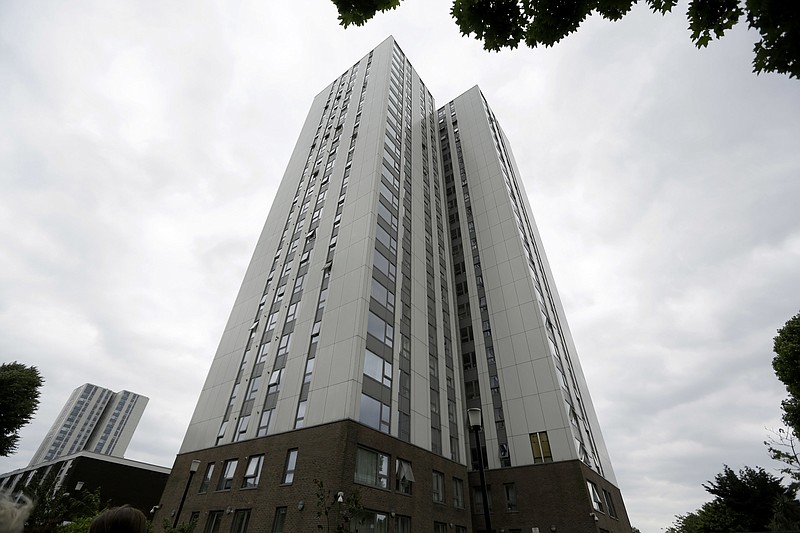 
              A view of Burnham residential tower on the Chalcots Estate showing the bottom section of the building after cladding  was removed, in the borough of Camden, north London, Thursday, June 22, 2017. Tests so far have found that at least three high-rise apartment buildings in the U.K. have flammable external panels like the ones believed to have contributed to a fire that killed 79 people in London, Britain's government said Thursday. The local council in Camden, a borough of London, removed cladding from one of its buildings for further testing after tests they commissioned showed some of their panels were of the flammable variety — and not the ones they ordered.? It was unclear whether the Camden example was one of the three mentioned by the government.  (AP Photo/Matt Dunham)
            