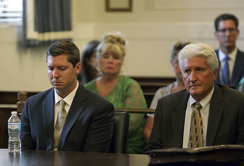 Former University of Cincinnati police officer Raymond Tensing, left, and his attorney Stew Mathews listen as Hamilton County Common Pleas Judge Leslie Ghiz declares a mistrial on Friday, June 23, 2017 in Cincinnati. Tensing was charged with murder and voluntary manslaughter in the shooting of unarmed black motorist Sam DuBose during a 2015 traffic stop. (Cara Owsley /The Cincinnati Enquirer via AP, Pool)