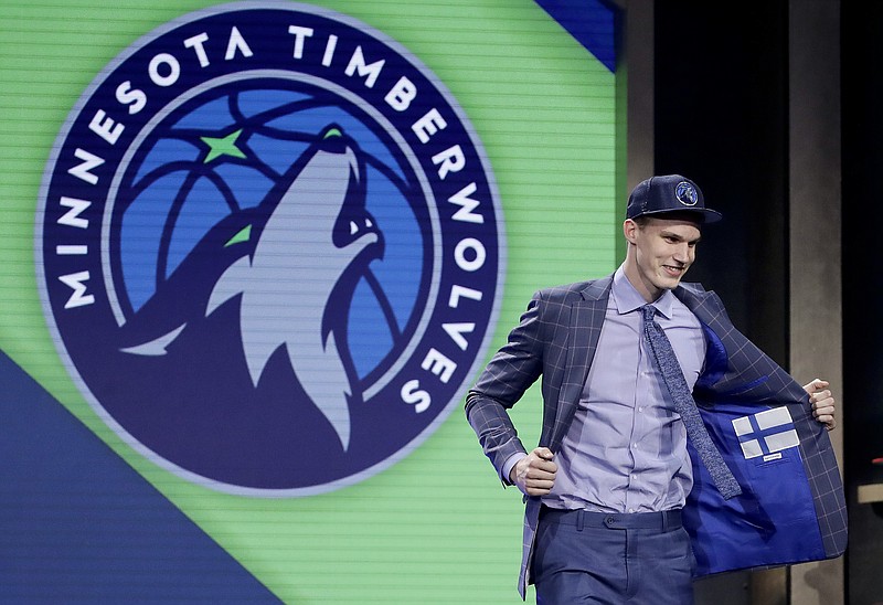 
              Lauri Markkanen reacts after being selected by the Minnesota Timberwolves as the seventh pick overall during the NBA basketball draft, Thursday, June 22, 2017, in New York. (AP Photo/Frank Franklin II)
            
