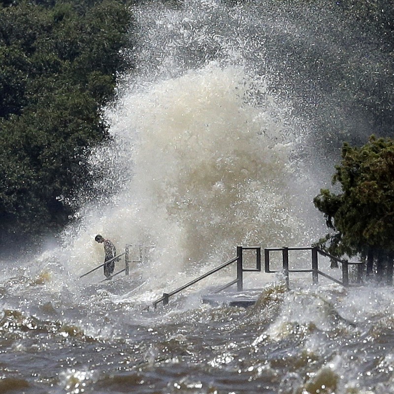 
              Wth a rising tide, strong southerly winds from Tropical Depression Cindy lash the lakefront Thursday, June 22, 2017 in Mandeville, La. (David Grunfeld/NOLA.com The Times-Picayune via AP)
            