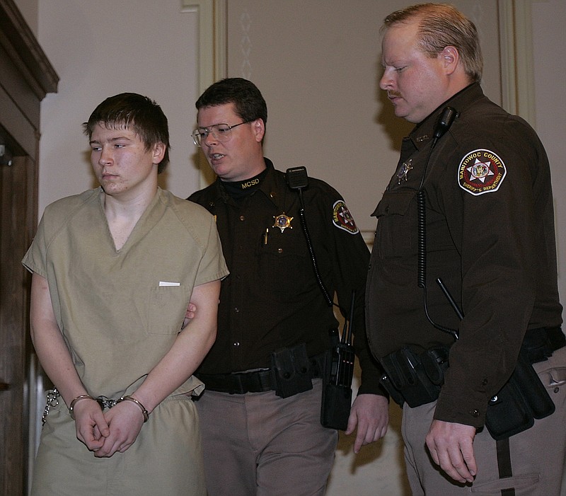 
              FILE - In a Friday, March 3, 2006 file photo, Brendan Dassey is escorted out of a Manitowoc County Circuit courtroom, in Manitowoc, Wis. A three-judge panel from the 7th Circuit on Thursday, June 22, 2017 affirmed that Dassey, a Wisconsin inmate featured in the Netflix series "Making a Murderer" was coerced into confessing and should be released from prison. Dassey was sentenced to life in prison in 2007 in photographer Teresa Halbach's death two years earlier.  (AP Photo/Morry Gash, File)
            
