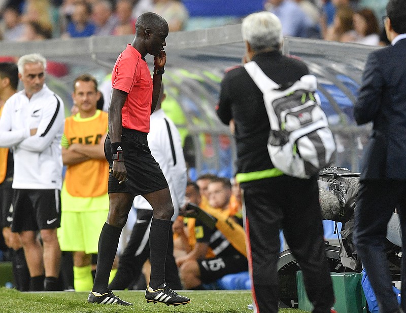 
              Gambian referee Bakary Gassama walks off the pitch after the Confederations Cup, Group A soccer match between Mexico and New Zealand, at the Fisht Stadium in Sochi, Russia, Wednesday, June 21, 2017. (AP Photo/Martin Meissner)
            