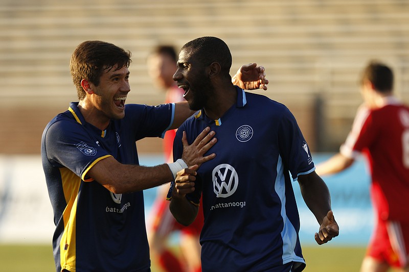 CFC's Felipe Antonio, right, celebrates scoring their initial goal with teammate Jose Francisco Ferraz during Chattanooga FC's soccer match against Carolina United FC at Finley Stadium on Saturday, June 24, 2017, in Chattanooga, Tenn.