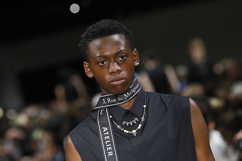 
              A model wears a creation as part of Christian Dior Men's Spring Summer 2018 fashion collection, presented in Paris, France, Saturday, June 24, 2017. (AP Photo/Francois Mori)
            