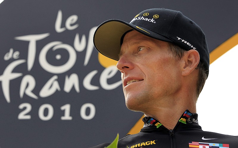 FILE- In this July 25, 2010, file photo, Lance Armstrong, of the United States, looks back on the podium after the 20th and last stage of the Tour de France cycling race in Paris. Armstrong's $100 million civil fraud trial is months away, yet his fight with the government and former teammate-turned-rival Floyd Landis is heating up. The trial is scheduled for November in federal court in Washington D.C., and lawyers for both sides recently filed a series of motions asking U.S. District Judge Christopher Cooper to exclude some key evidence. (AP Photo/Bas Czerwinski, File)