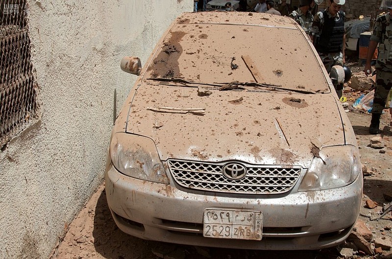 
              This Friday, June 23, 2017 photo released by Saudi Press Agency, SPA, shows the scene of a suicide bombing after a police raid in Mecca, Saudi Arabia. Police said the bomber shot at them when they tried to raid the three-story house and that the man blew himself up during the confrontation, leading to the building's collapse. (Saudi Press Agency via AP)
            