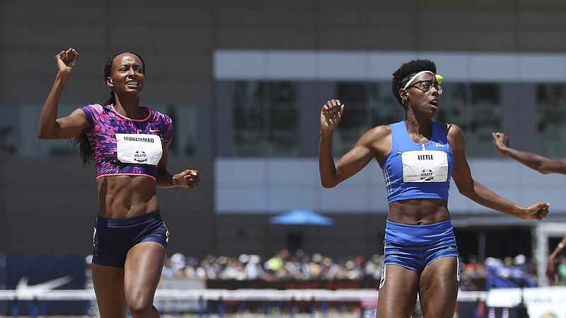 
              Dalilah Muhammad, left, reacts as she crosses the finish line ahead of second-place finisher Shamier Little, right, in the women's 400-meter hurdles at the U.S. Track and Field Championships, Sunday, June 25, 2017, in Sacramento, Calif. (AP Photo/Rich Pedroncelli)
            