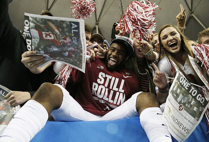 T.J. Simmons celebrates with fans after Alabama's Peach Bowl victory against Washington this past New Year's Eve. The sophomore wide receiver posted Sunday on social media that he will transfer to West Virginia.