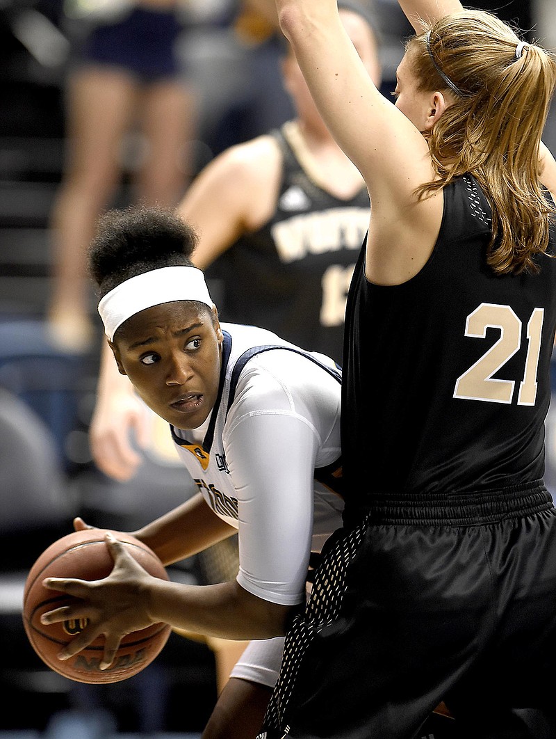 Aryanna Gilbert, left, and sister Keiana are the only seniors on the roster for the UTC women's basketball team in 2017-18.