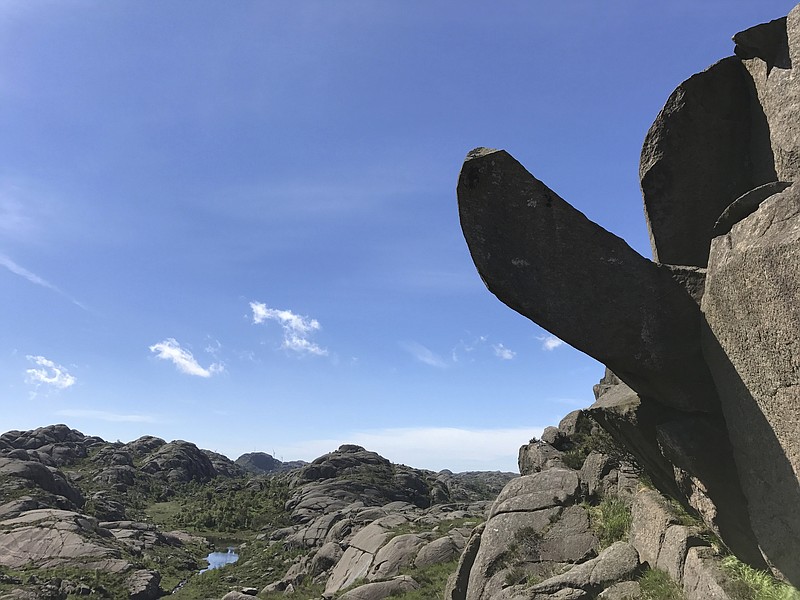 
              This undated photo shows the rock formation Trollpikkenin before its damage, in Egersund, western Norway. A group of activists have started to collect money to repair the penis-shaped rock formation and a popular tourist attraction after it was found badly damaged Saturday June 24, 2017. It was discovered cracked complete with drilling holes in the rock - something that experts say suggests strongly that it was cut off on purpose. (Ingve Aalbu/NTB Scanpix via AP)
            
