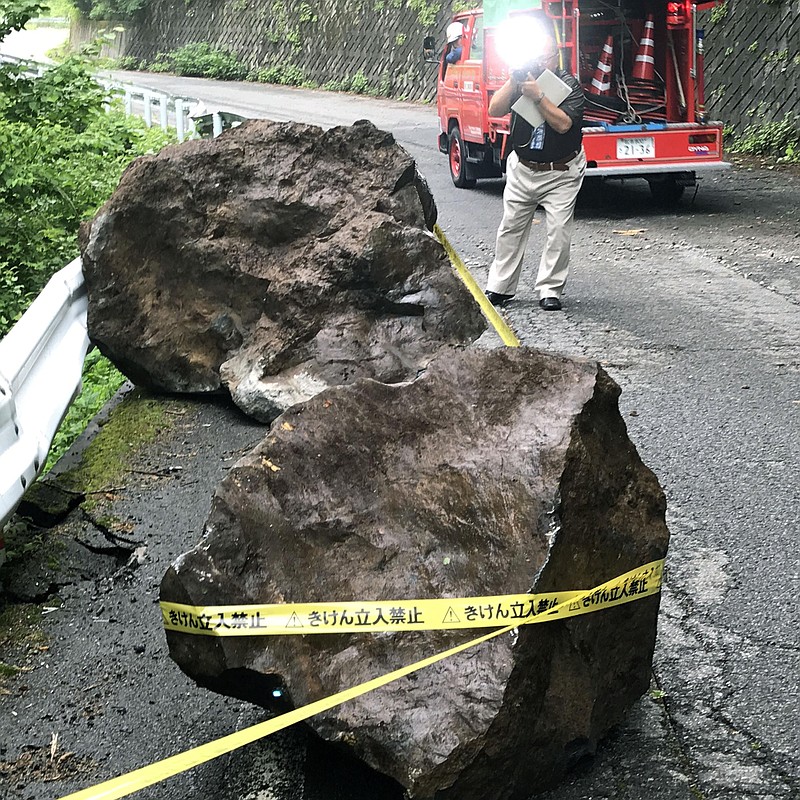 
              Fallen rocks block a road after an earthquake in Otaki village, central Japan, Sunday, June 25, 2017.  A strong earthquake has shaken residents in a mountainous region of central Japan, injuring at least two people and knocking roof tiles off homes. (Koji Harada/Kyodo News via AP)
            