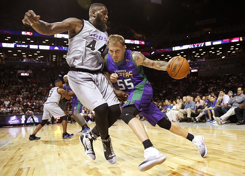 
              3 Headed Monsters Jason Williams (55) drives up against Ghost Ballers Ivan Johnson (44) during the first half of Game 1 in the BIG3 Basketball League debut, Sunday, June 25, 2017, at the Barclays Center in New York. (AP Photo/Kathy Willens)
            