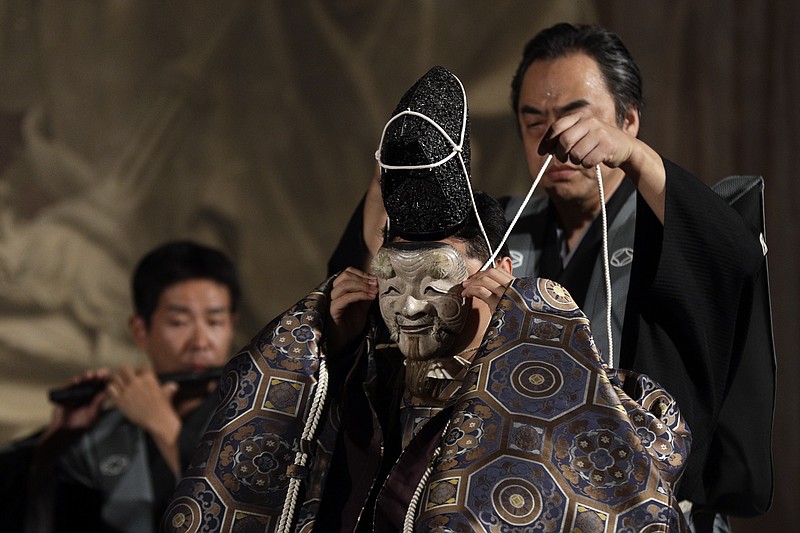 
              Japanese actor Kazufusa Hosho, impersonating Okina, performs during a traditional Noh theater representation, on the occasion of the celebrations for the 75th anniversary of the diplomatic relations between the Vatican and Japan, in Rome's Palazzo della Cancelleria, Saturday, June 24, 2017. (AP Photo/Gregorio Borgia)
            
