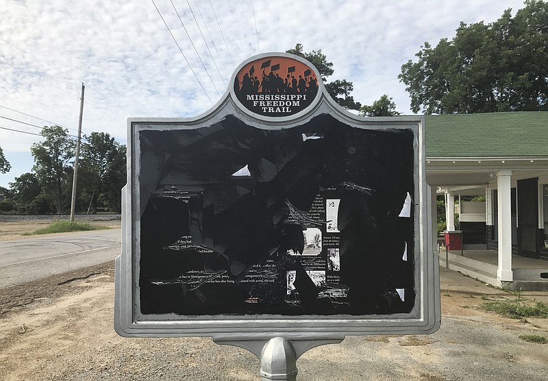
              In this June 2017 photo, released by Allan Hammons, a civil rights historical marker in Money, Miss. is seen. The marker remembers black teenager Emmett Till, who was kidnapped before being lynched in 1955. Allan Hammons, whose public relations firm made the marker, said Monday that someone scratched the marker with a blunt tool in May.(Allan Hammons via AP)
            