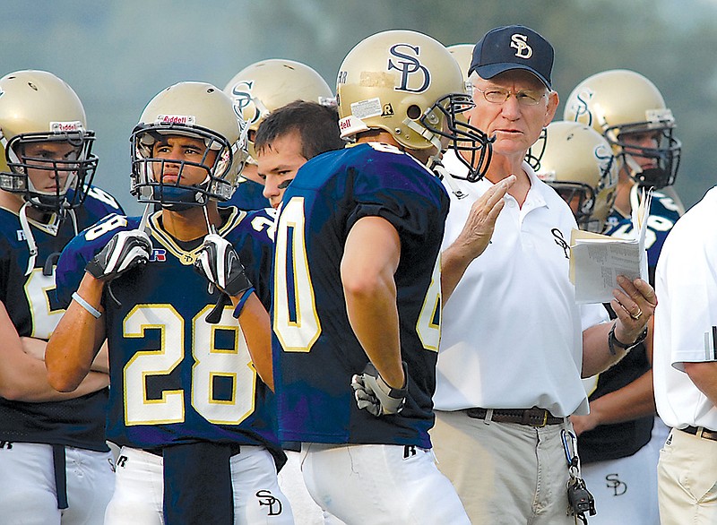 Soddy-Daisy High School football coach Tom Weathers talks with his players during warm-ups prior to the season opener against Red Bank on Friday, Aug. 31, 2007. Weathers had been the head football coach of Red Bank High School for several years. 