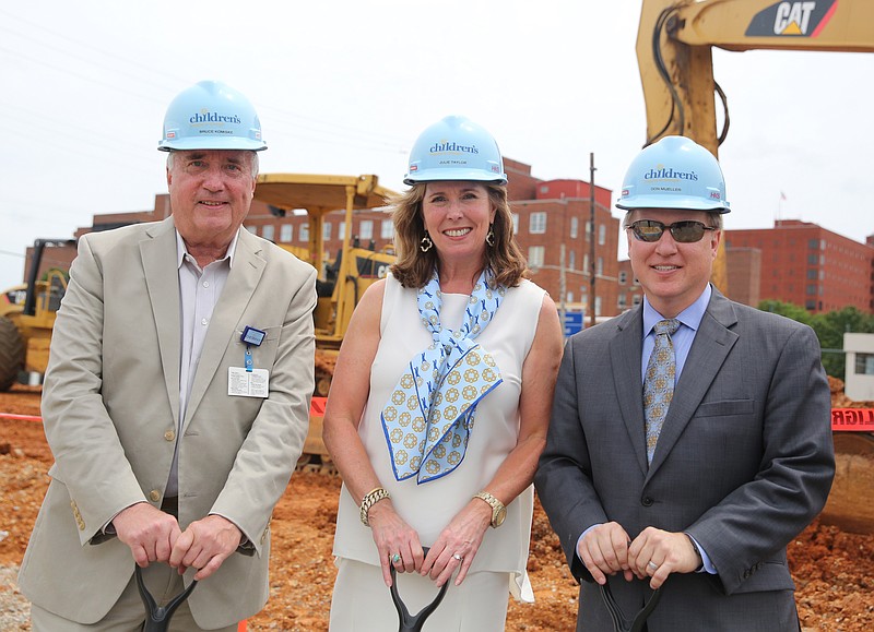 Erlanger's Vice President of New Hospital Design and Construction Bruce Komiske, Erlanger's Chief Development Officer and President Julie Taylor, and Erlanger's Chief Executive Officer for Children's Hospital Don Mueller, from left, helped break ground in a ceremony for the new Erlanger Children's Hospital on Third Street.