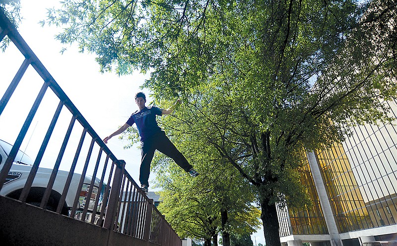 Ethan Young practices parkour downtown.
