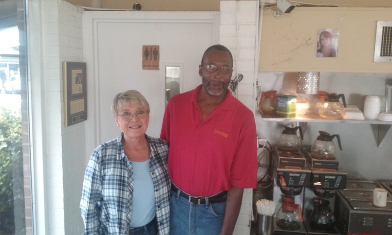 Susan Danner, Longhorn co-owner, and longtime employee Willie Kimble at the restaurant where Kimble worked for 41 years. Thursday is his last day.