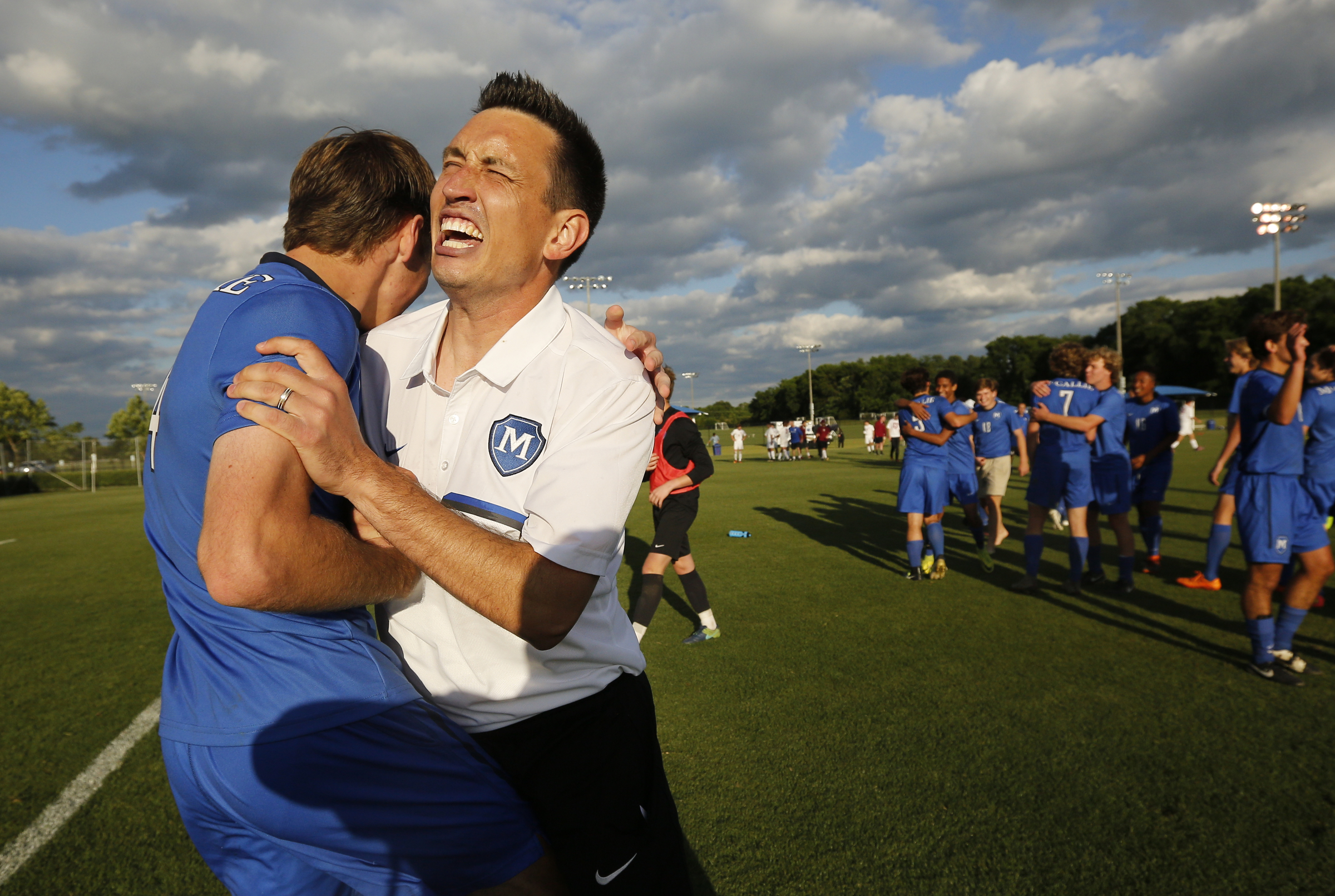McCallie soccer coach Chris Cushenbery, right, embraces player William Hart after their TSSAA Division II-AA state soccer tournament championship victory over MBA on Thursday, May 25, 2017, in Murfreesboro, Tenn. McCallie won 3-2 to seal the championship.