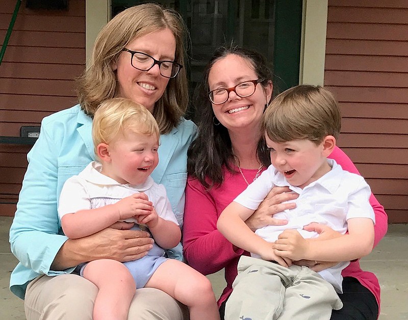 
              In this undated photo provided by Jana and Leigh Jacobs, the Jacobses pose with their sons Finch, left, and Yogi. The couple challenged an Arkansas birth-certificate policy that defined parents by gender. The U.S. Supreme Court rejected the policy Monday, June 26, 2017. (Jeanne Wilson photo/ provided by Jana and Leigh Jacobs via AP)
            