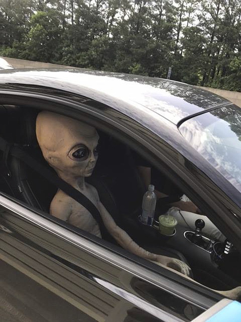 
              In this Sunday, June 25, 2017 photo provided by the Alpharetta Department of Public Safety an alien figure sits in the passenger seat of a vehicle that was pulled over north of Atlanta, Ga. (Alpharetta Department of Public Safety via AP)
            