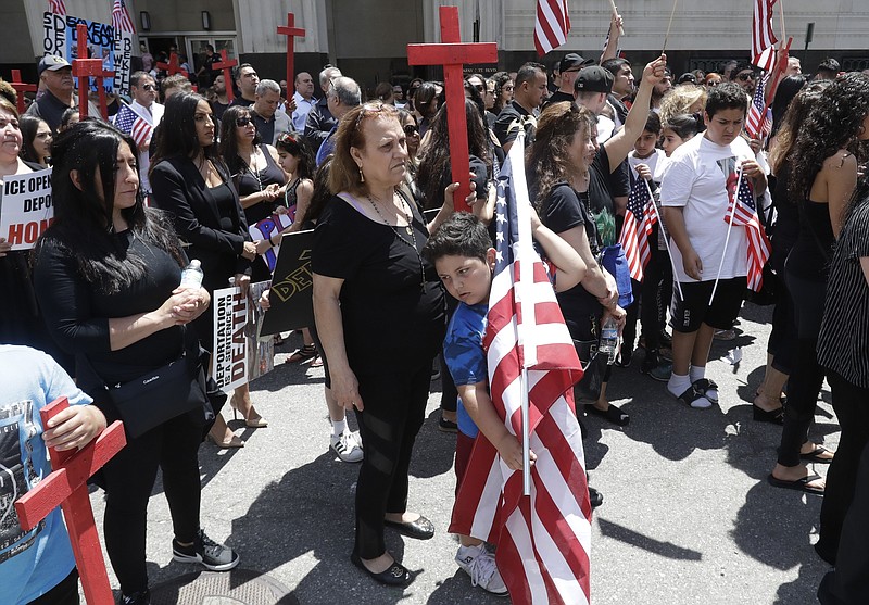 
              Iraqis and supporters rally outside the Theodore Levin United States Courthouse, Wednesday, June 21, 2017, in Detroit. A hearing began on a lawsuit that seeks to stop the government from deporting more than 100 Iraqi nationals who were recently rounded up. The American Civil Liberties Union filed the lawsuit in federal court in Detroit against U.S. Immigration and Customs Enforcement seeking a temporary stay of deportations. The ACLU says possible deportations aren't expected at least until after the request is heard. (AP Photo/Carlos Osorio)
            