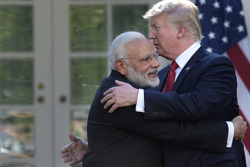 
              President Donald Trump and Indian Prime Minister Narendra Modi hug after making joint statements in the Rose Garden of the White House in Washington, Monday, June 26, 2017. (AP Photo/Susan Walsh)
            
