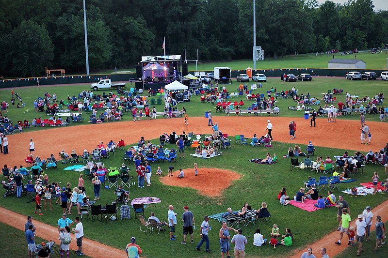 In Tullahoma, Tenn., vendors and a Kids' Zone are set up in Frazier-McEwen Park while the music stage is center field in Grider Stadium.
