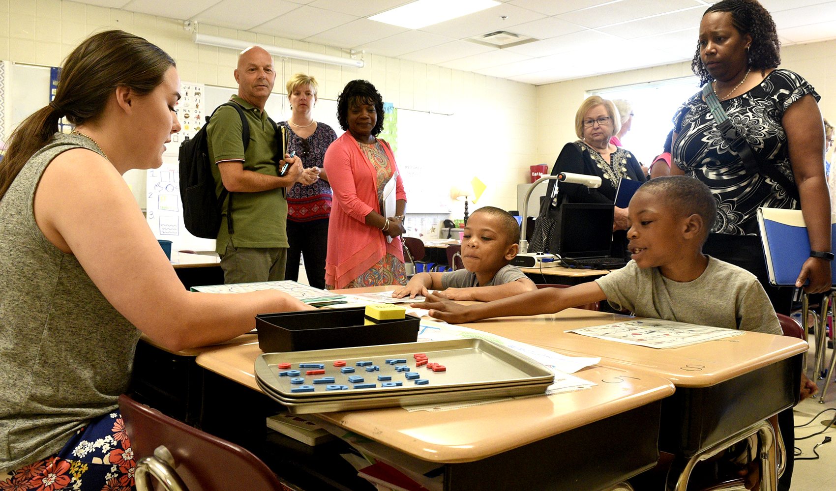 From left, Ashley Lepard of East Side Elementary works with Hardy Hope participants Marquise McMurray and Joeric McLemore while they are observed by Hamilton County elementary principals. Hamilton County's elementary principals gathered at Hardy Elementary to learn new tips for boosting literacy throughout their schools on June 27, 2017.