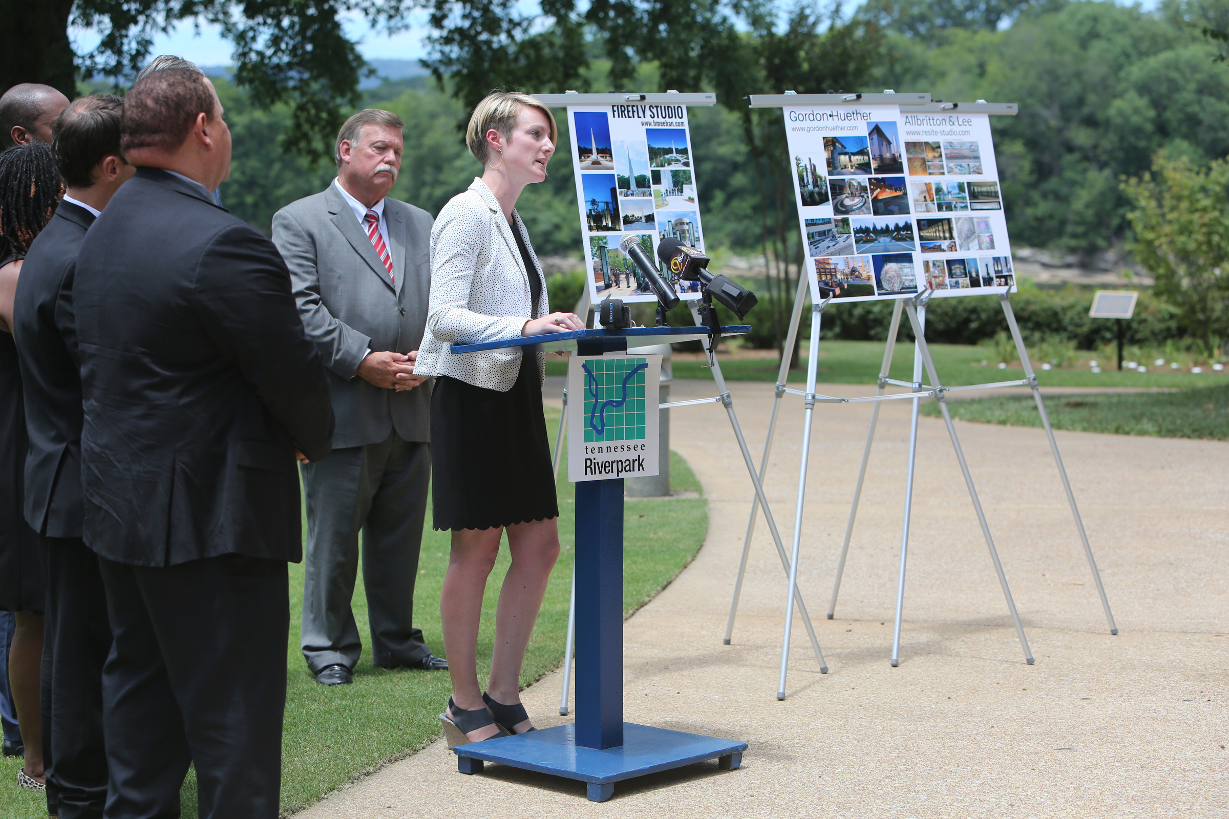 Director of Public Art Chattanooga Katelyn Kirnie speaks about each of the three artists chosen as semifinalists to design a permanent memorial for the Fallen Five Tuesday, June 27, 2017, at the Hubert Fry Center Pavilion in Chattanooga, Tenn. The three semifinalists, Gordon Huether with Gates and Associates, Shane Allbritton and Norman Lee of Re:site, and Howard Meehan and William Freer of Firefly Studio will offer proposals in September, and by the end of the year one will be selected.