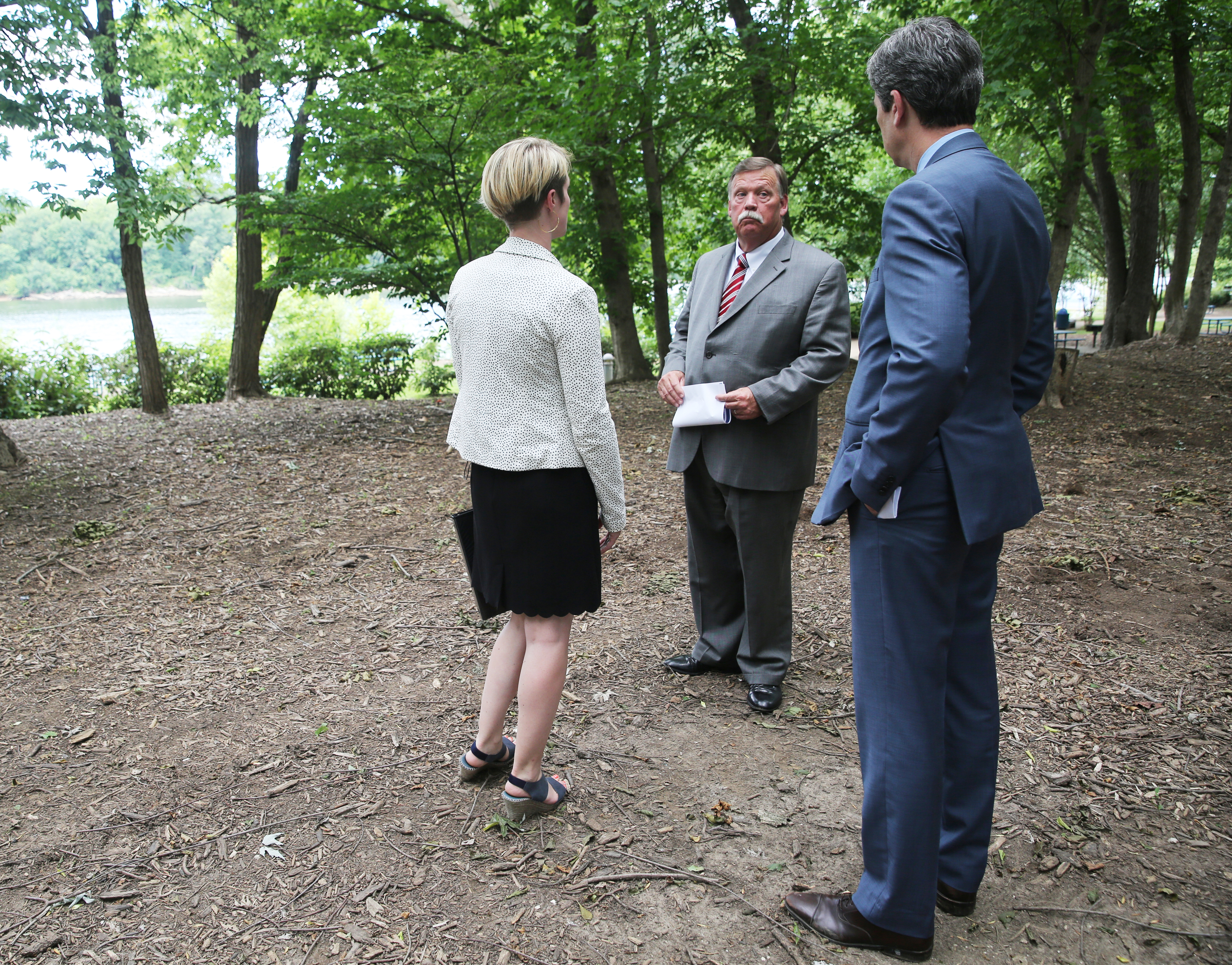 Director of Public Art Chattanooga Katelyn Kirnie, Hamilton County Mayor Jim Coppinger and Chattanooga Mayor Andy Berke check out one location a permanent memorial for the Fallen Five could go Tuesday, June 27, 2017, near the Hubert Fry Center Pavilion in Chattanooga, Tenn. The location is just a couple hundred feet from the naval reserve center that was attacked.