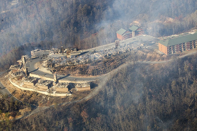 Burned structures are seen from aboard a National Guard helicopter near Gatlinburg, Tenn., Tuesday, Nov. 29, 2016. The fires spread quickly on Monday night, when winds topping 87 mph whipped up the flames, catching residents and tourists in the Gatlinburg area by surprise. Police banged on front doors and told people to get out immediately. (AP Photo/Erik Schelzig)