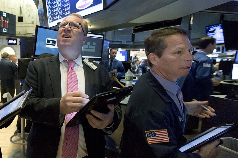 
              Trader Daniel Ryan, left, and Robert Charmak work at the post that handles Pandora on the floor of the New York Stock Exchange, Tuesday, June 27, 2017. Pandora, under intensifying pressure from Spotify and Apple Music, said Tuesday that CEO Tim Westergren has stepped down from that role. (AP Photo/Richard Drew)
            