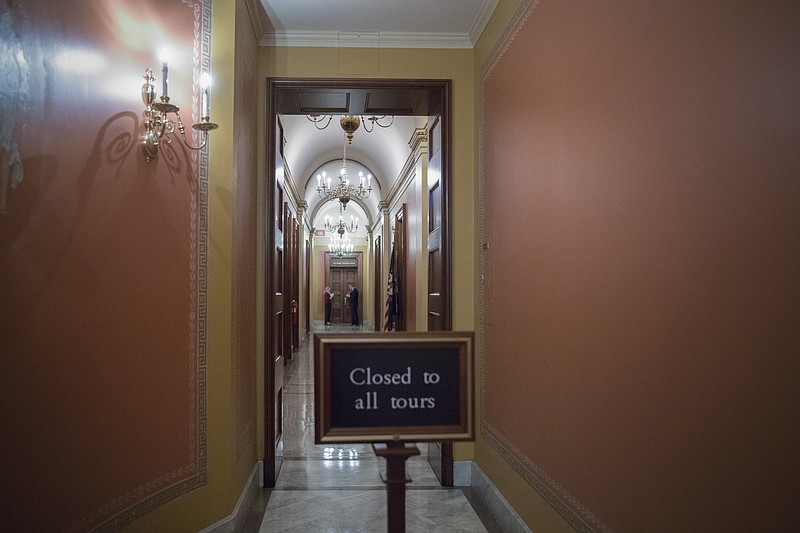 
              A closed corridor adjacent to the offices of Senate Majority Leader Mitch McConnell of Ky., leads to the Strom Thurmond Room on Hill Capitol in Washington, Monday, June 26, 2017, where the GOP health care bill has been written. (AP Photo/J. Scott Applewhite)
            