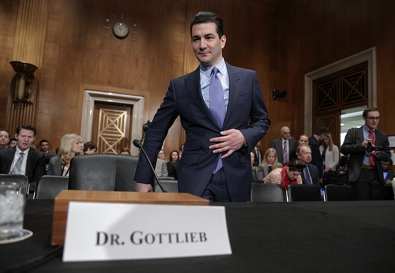 
              FILE - In this Wednesday, April 5, 2017, file photo, Dr. Scott Gottlieb, President Donald Trump's nominee to head the Food and Drug Administration, appears at his confirmation hearing before the Senate Committee on Health, Education, Labor, and Pensions, on Capitol Hill in Washington. The Food and Drug Administration is making two moves to rapidly increase the number of generic prescription drugs on sale in an effort to make medicines affordable and prevent future price gouging. New commissioner Gottlieb says the FDA will now give priority reviews to potential generic drugs until at least three are on the market. That’s the level at which prices tend to drop sharply, up to 85 percent off the brand-name price. (AP Photo/J. Scott Applewhite, File)
            