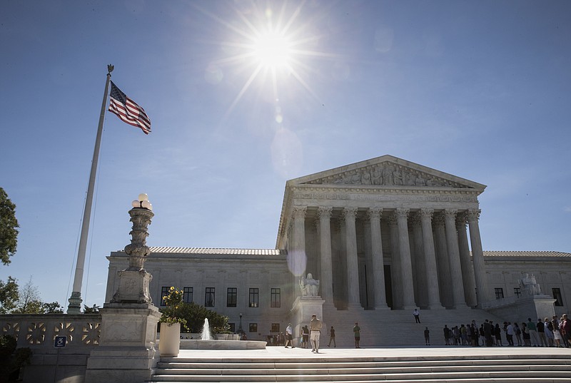 
              People visit the Supreme Court in Washington, Monday, June 26, 2017, as justices issued their final rulings for the term, in Washington.  The Supreme Court began its term nine months ago with Merrick Garland nominated to the bench, Hillary Clinton favored to be the next president, and the court poised to be controlled by Democratic appointees for the first time in 50 years.  Things looked very different when the justices wrapped up their work this week.   (AP Photo/J. Scott Applewhite)
            