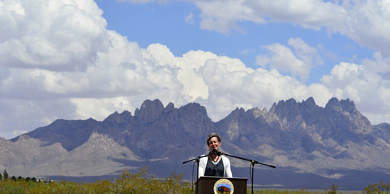 
              FILE - In this May 23, 2014 file photo, Secretary of the Interior Sally Jewell speaks with the local community and other federal, state, tribal and local leaders celebrating President Obama's designation of the Organ Mountains-Desert Peaks National Monument at Onate High School in Las Cruces, N.M. The Organ Mountains-Desert Peaks National Monument is among 27 monuments where a review has been ordered by President Donald Trump that might remove protections previously considered irreversible.  (Carlos Javier Sanchez/The Las Cruces Sun-News via AP, file)
            