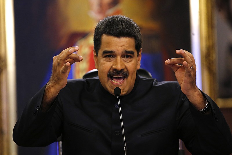 
              FILE - In this June 22, 2017 file photo, Venezuela's President Nicolas Maduro gives a news conference in Caracas, Venezuela.  Maduro said a helicopter fired on Venezuela's Supreme Court in a confusing incident that he claimed was part of a conspiracy to destabilize his socialist government, on Tuesday, June 27, 2017. (AP Photo/Ariana Cubillos, File)
            