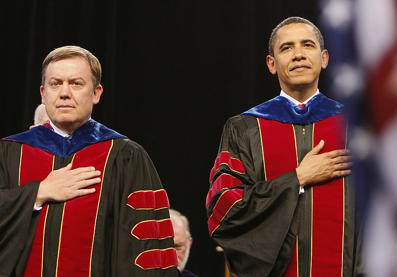 
              FILE - In this Wednesday, May 13, 2009, file photo, President Barack Obama stands with Arizona State University President Michael Crow during the trooping of the colors at the Arizona State University commencement ceremony at Sun Devil Stadium in Tempe, Ariz. Crow is the highest paid public university president in the nation making almost $1.6 million. (AP Photo/Charles Dharapak)
            