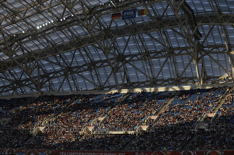 
              FILE In this Sunday, June 25, 2017 file photo, spectators sit in the stands during the Confederations Cup, Group B soccer match between Germany and Cameroon, at the Fisht Stadium in Sochi, Russia. After years of controversy, Russian officials think their World Cup has weathered the storm. Questions have receded over the legitimacy of the 2010 vote that gave Russia the tournament, the stadiums are either finished or nearing completion, and the Confederations Cup is going smoothly.(AP Photo/Thanassis Stavrakis/File)
            