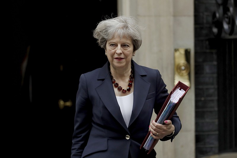 
              British Prime Minister Theresa May leaves 10 Downing Street in London, to attend Prime Minister's Questions at the Houses of Parliament, Wednesday, June 28, 2017. (AP Photo/Matt Dunham)
            