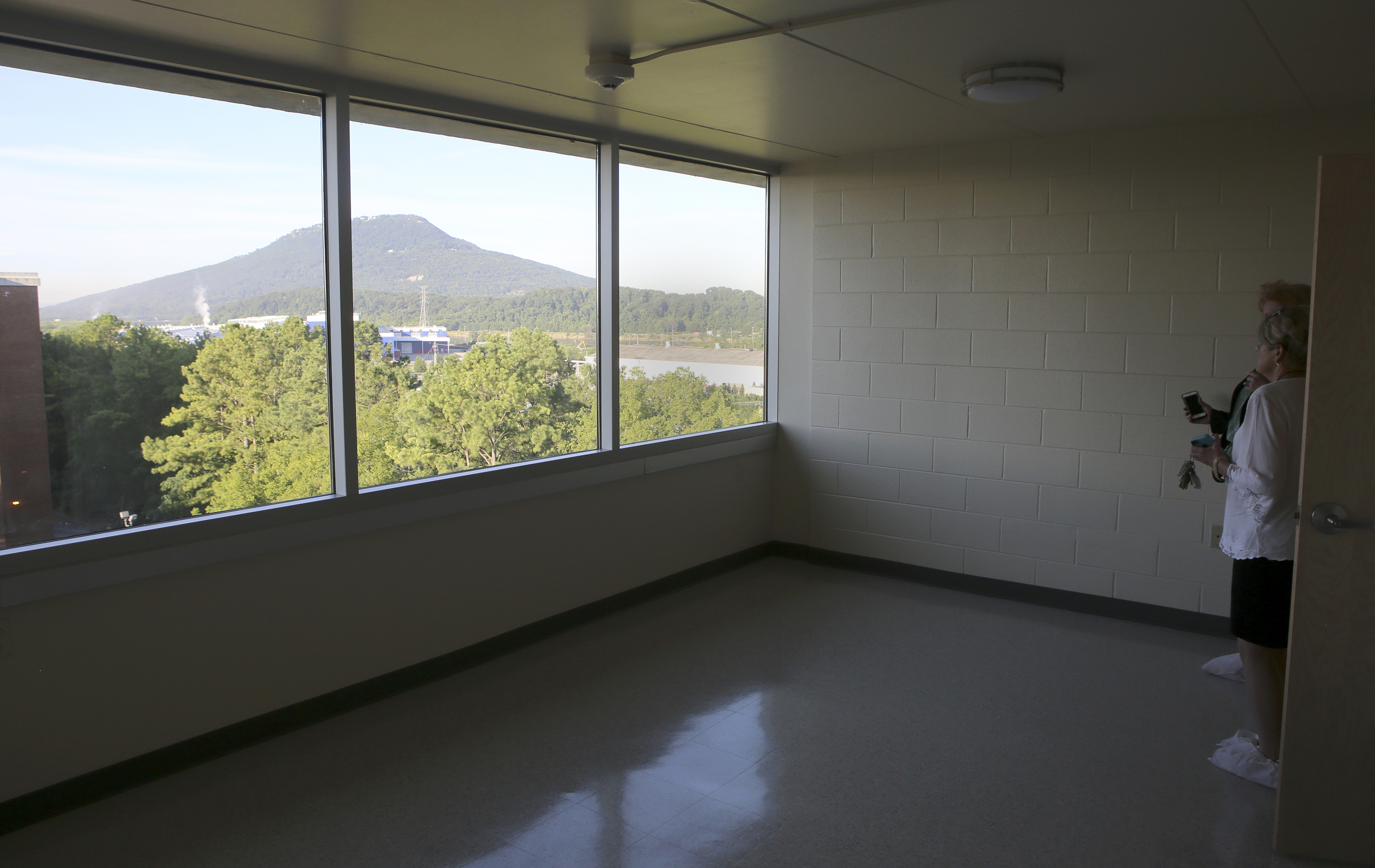 Chattanooga Housing Authority Executive Director Betsy McCright (white) tours a newly renovated unit with public relations agent Robin Derryberry at Boynton Terrace Apartments on Wednesday, June 28, in Chattanooga, Tenn.