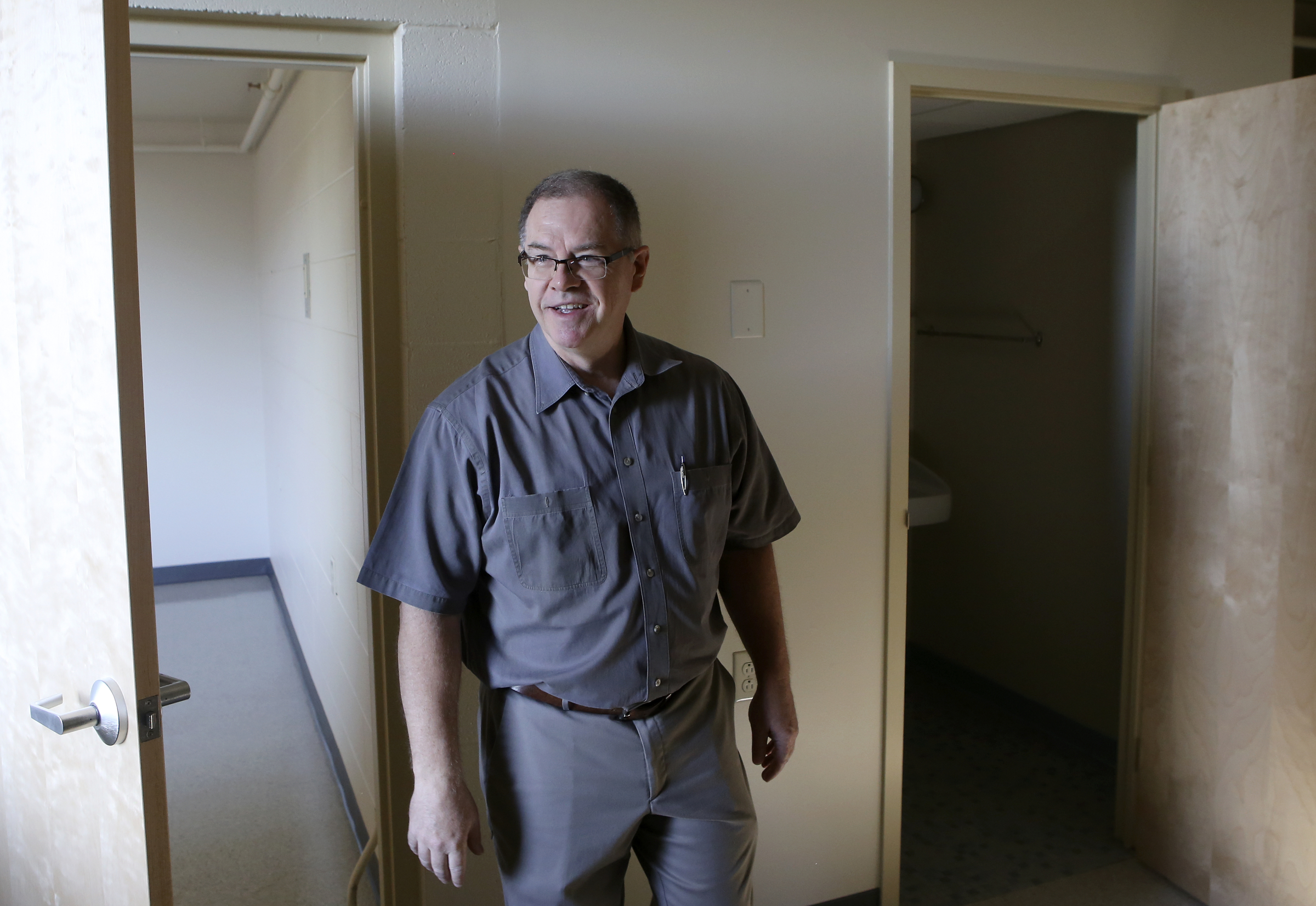Lonnie Edwards, the project manager for the renovation of Boynton Terrace Apartments, leads a tour of one of the units on Wednesday, June 28, in Chattanooga, Tenn.