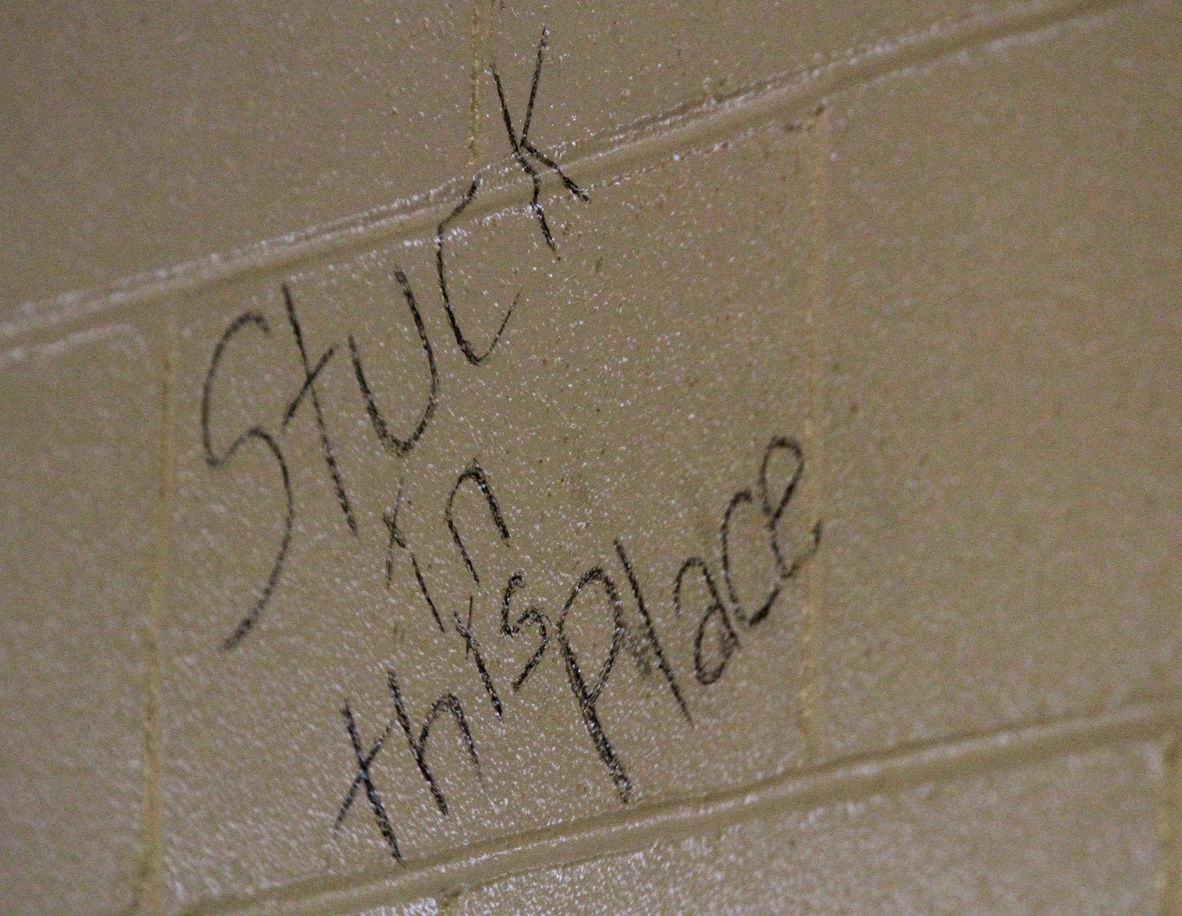 A piece of graffiti reading "Stuck in this Place" is seen on the wall where the women inmates are held at the Rhea County Jail on Wednesday, June 28, in Dayton, Tenn.