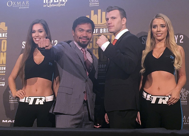 
              Boxers Manny Pacquiao of the Philippines, second left, and Jeff Horn of Australia, second right, pose for a photo in Brisbane, Wednesday, June 28, 2017. Pacquiao, is putting his WBO belt on the line Sunday, July 2, against the 29-year-old Horn. (AP Photo/John Pye)
            