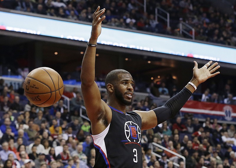 
              FILE - In this Dec. 28, 2015, file photo, Los Angeles Clippers guard Chris Paul reacts after dunking the ball during the first half of an NBA basketball game against the Washington Wizards, in Washington. The Houston Rockets have reached an agreement to trade for Los Angeles Clippers point guard Chris Paul according to a person familiar with the deal. The league source spoke to The Associated Press on Wednesday, June 28, 2017,  on the condition of anonymity because the team hasn't finalized the trade.(AP Photo/Carolyn Kaster, File)
            