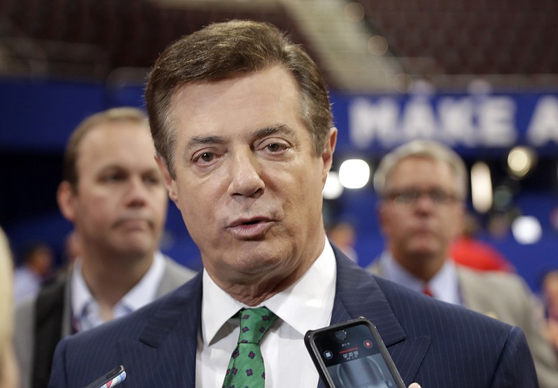 
              FILE - In this July 17, 2016 file photo, then-Donald Trump campaign chairman Paul Manafort talks to reporters on the floor of the Republican National Convention, in Cleveland. Manafort, President Donald Trump's former campaign chairman, has registered with the Justice Department as a foreign agent for political consulting work he did for a Ukrainian political party, acknowledging he coached party members on how to interact with U.S. government officials. (AP Photo/Matt Rourke, File)
            