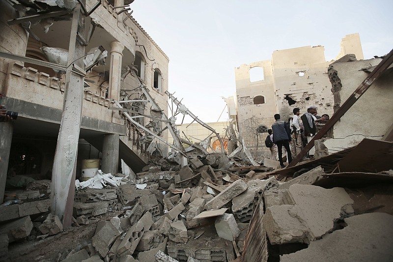 
              FILE -- In this Jun. 9, 2017 file photo, people stand on the rubble of houses destroyed by Saudi-led airstrikes in Sanaa, Yemen. More than two years of civil war have led to continually compounding disasters in Yemen. Fighting rages on in a deadly stalemate, the economy has been bombed into ruins, hunger is widespread, and a new misery has been added: Cholera, the world’s biggest current outbreak with more than 200,000 cases. (AP Photo/Hani Mohammed, File)
            