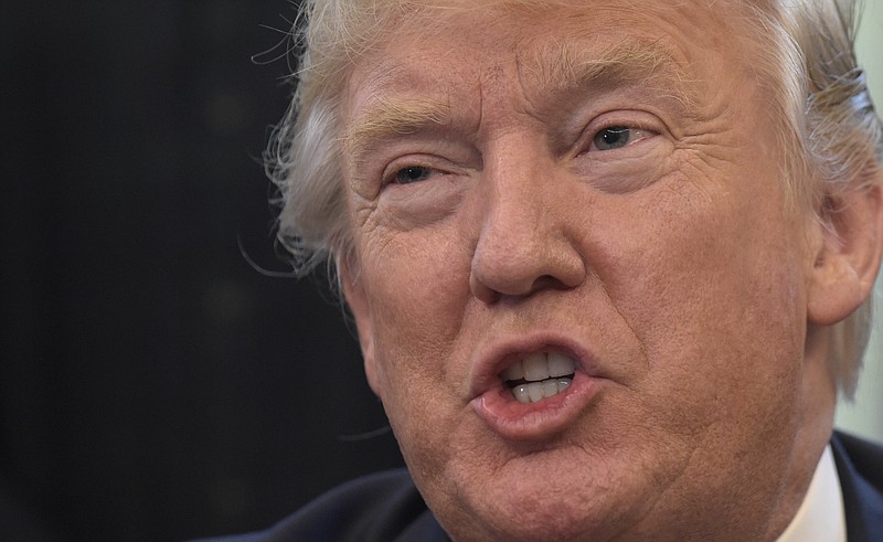 
              President Donald Trump answers a question about health care during a meeting with the 2016 World Series Champions Chicago Cubs, Wednesday, June 28, 2017, in the Oval Office of the White House in Washington. (AP Photo/Susan Walsh)
            