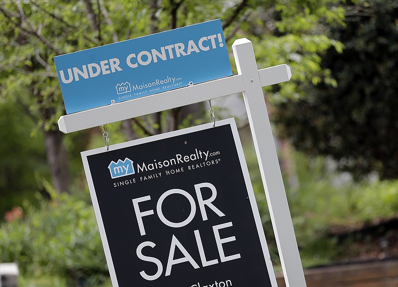 
              FILE - In this Thursday, April 27, 2017, file photo, an "Under Contract" sign is posted in front of a home for sale in Charlotte, N.C. On Wednesday, June 28, 2017, the National Association of Realtors releases its May report on pending home sales, which are seen as a barometer of future purchases. (AP Photo/Chuck Burton, File)
            